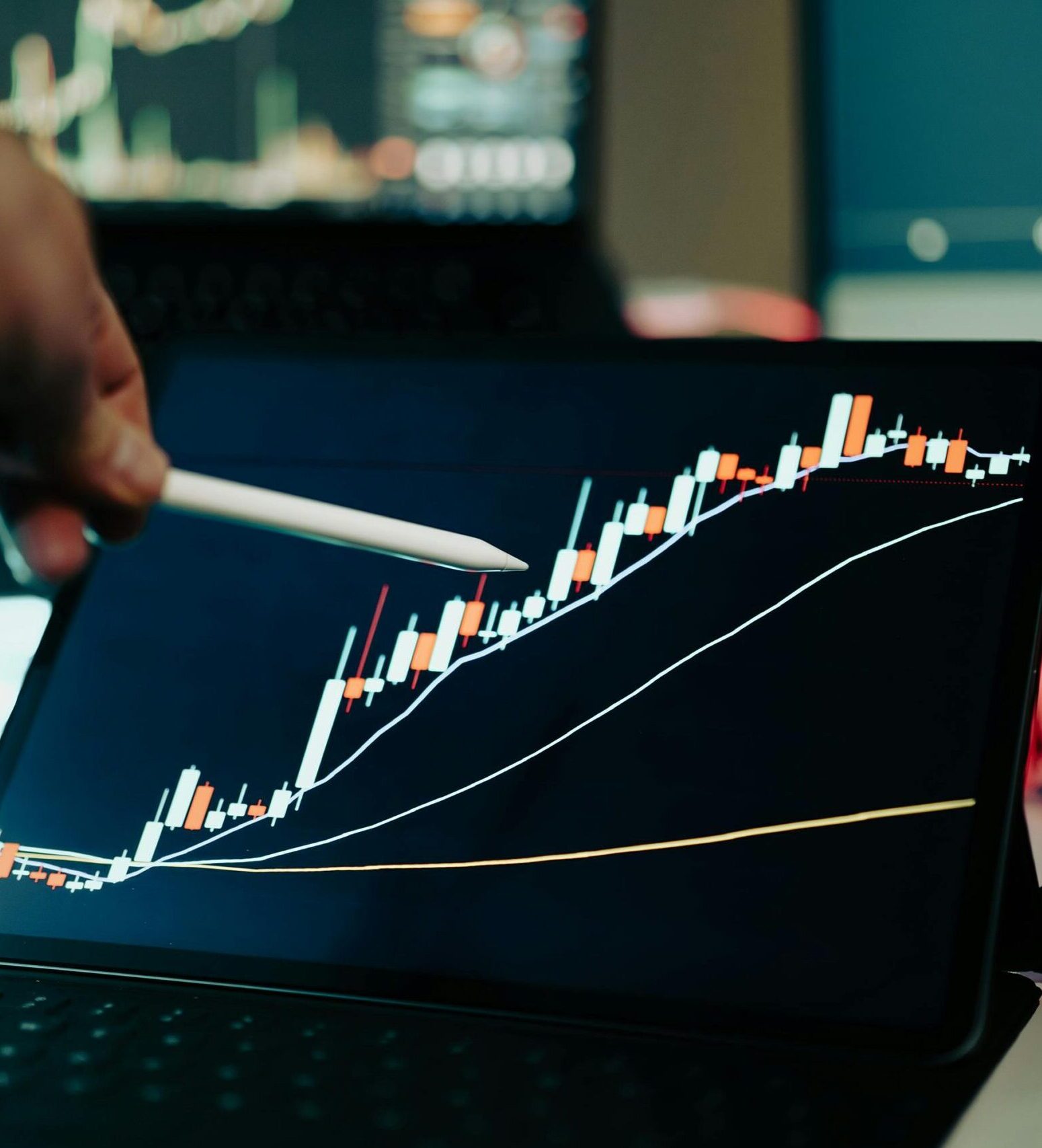 Close-up of a digital tablet showing a financial growth chart with graphs and trends under analysis.